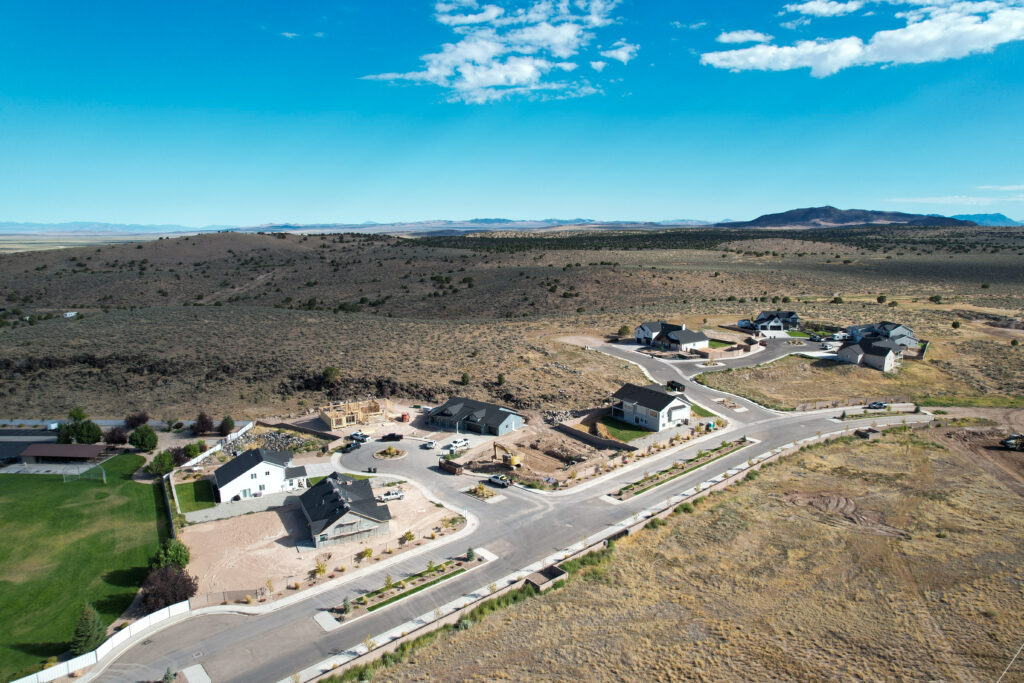 Aerial view of Pinnacle Ridge community in Cedar City with new homes and surrounding desert landscape